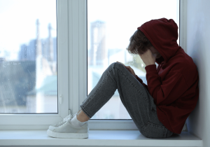 distant teen isolating from parent support seeking out adolescent counselling and teen therapy