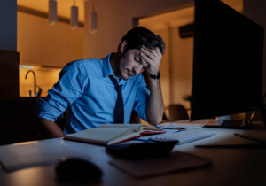 man with high functioning anxiety overworking himself avoid burnout and get help with anxiety therapy for stress management techniques